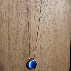 Cute silver tone necklace with blue pendent